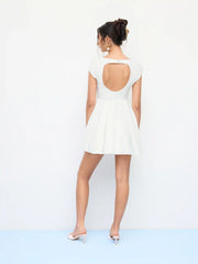 Sculptural Boat Neck Short Sleeve Cut Out Backless Ruffle Mini Dress
